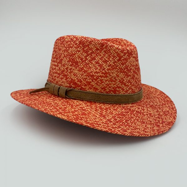 orange summer straw hat plantation